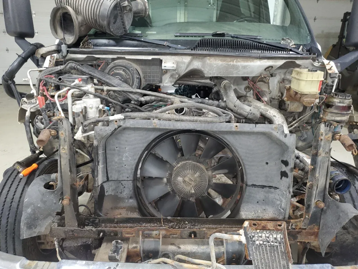 Heavy-duty truck front end opened for cooling and electrical repair